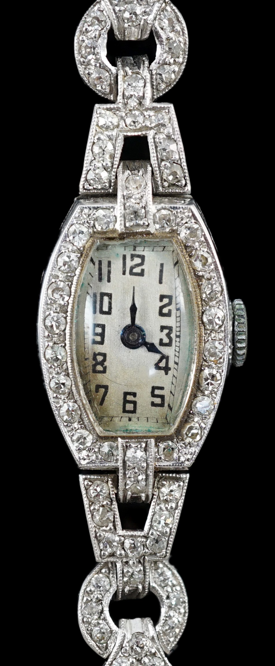 A lady's 1920’s platinum and round brilliant cut diamond set manual wind cocktail watch, on a white gold expanding bracelet